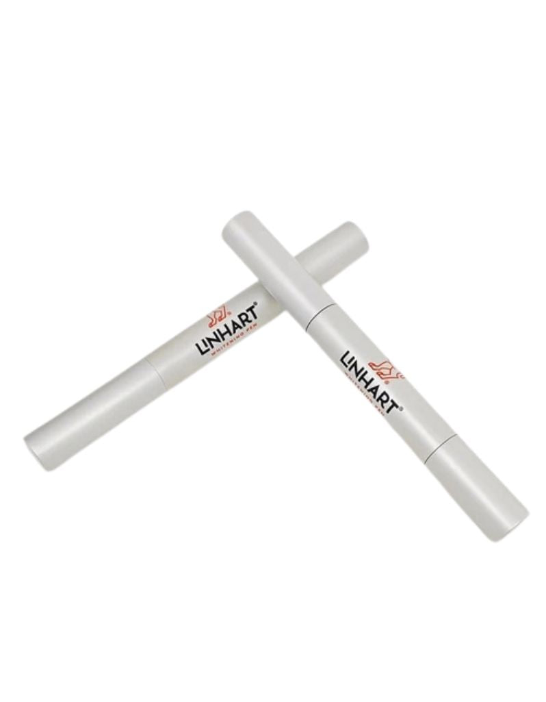 Two capped Linhart NYC Whitening Pens in silver, sized for pocket or bag