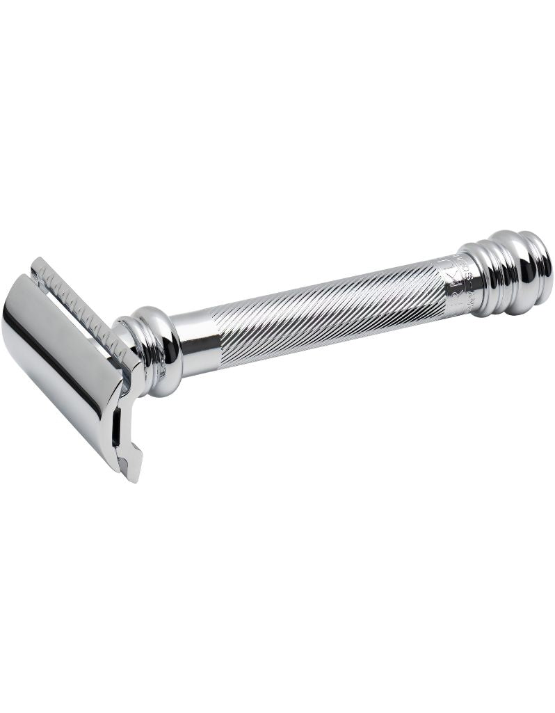 A long-handled, chrome-plated safety razor with a fluted handle and a straight razor head. Merkur 38C