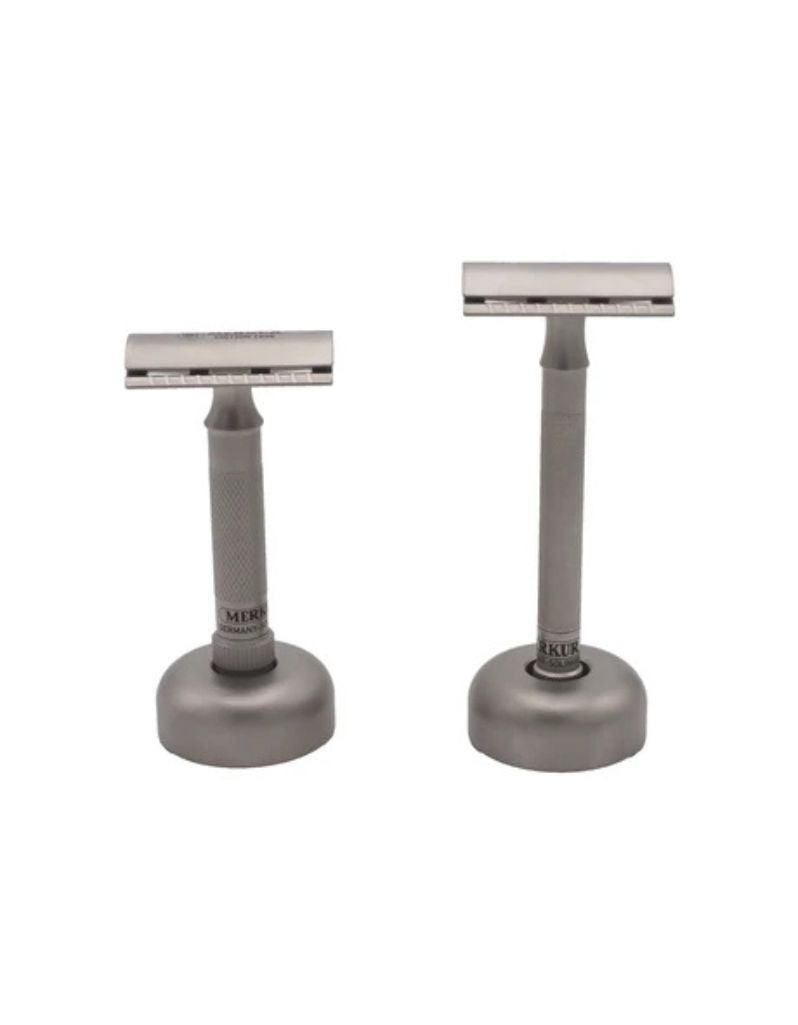 Merkur 4011 Inox razor stand holding two Merkur safety razors on a white background.