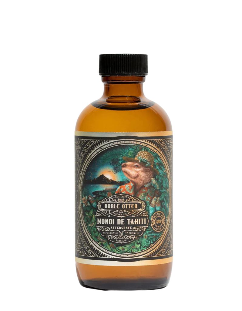 Noble Otter Monoi de Tahiti aftershave in an amber glass bottle with a tropical label of an otter in a floral shirt