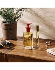 Number Six Eau de Parfum bottle on wooden table with plant, personal care