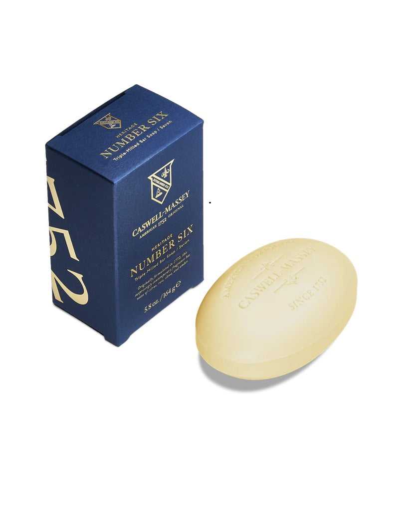 Bar of Number Six soap and its packaging on a white background