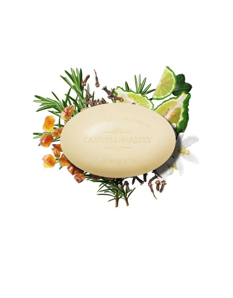 Bar of soap with herbs and flowers on a white background