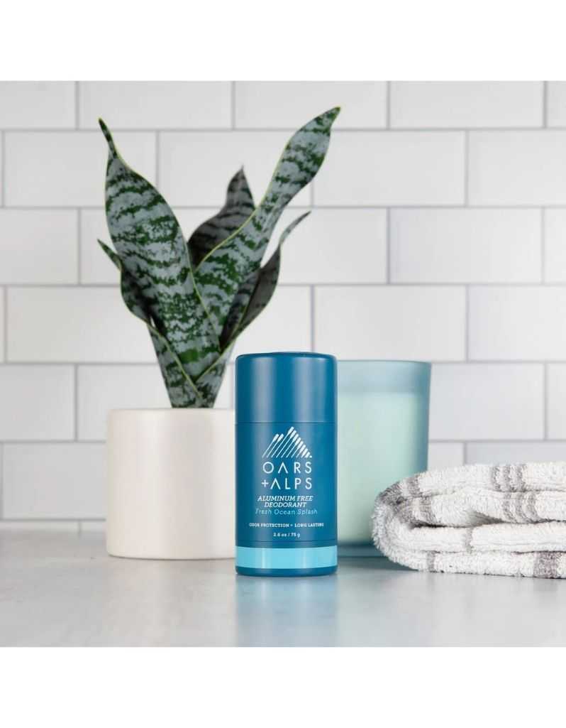 Deodorant on bathroom counter with plant