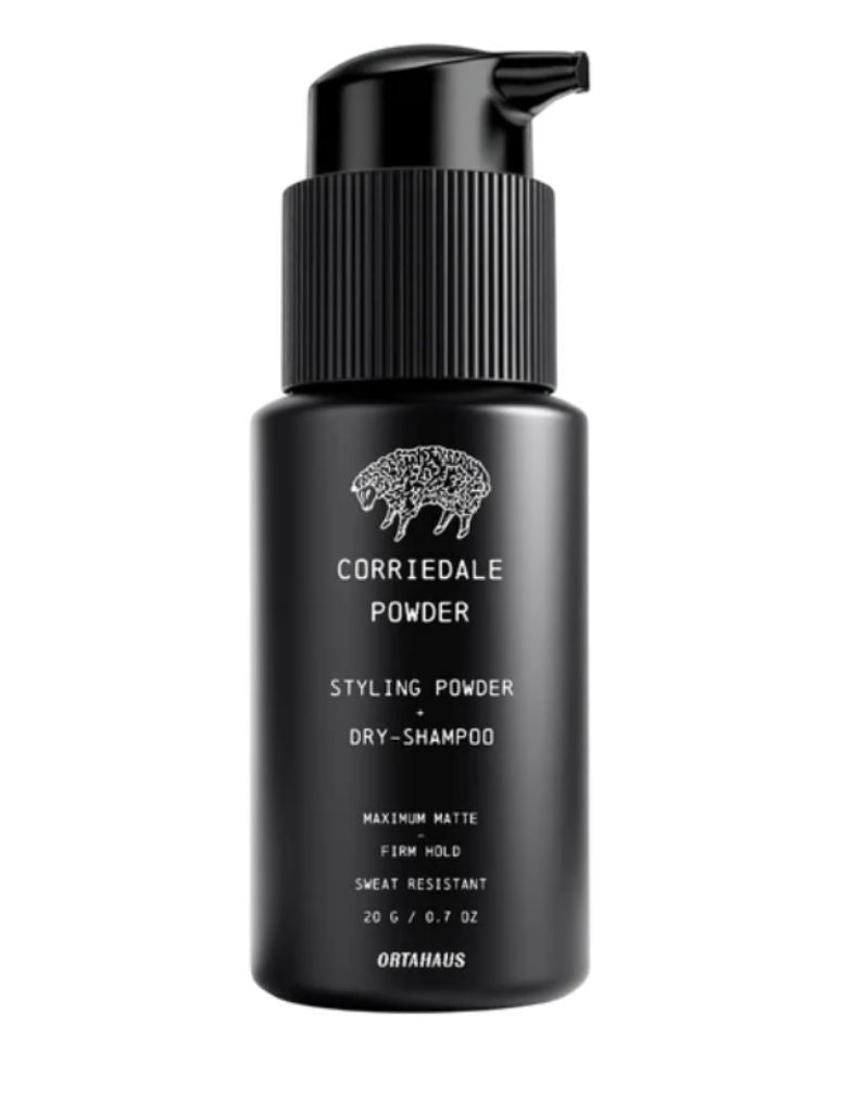 OrtaHaus Corriedale Powder, a sweat resistant volumizing hair powder for texture and matte hold. Absorbs oil for all day control. In a black bottle.
