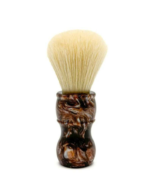 A shaving brush with a beige knot and an iridescent brown tortoise-like handle 