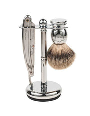 A Parker shavette set comprising a stainless steel razor with a chrome handle, a pure badger brush with a chrome handle, and a chrome stand, all displayed in a gift box.