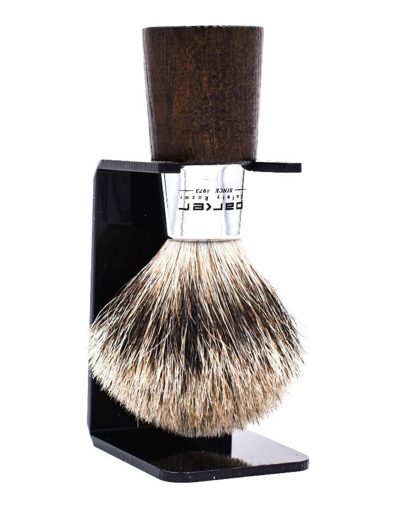 Parker pure badger shaving brush with a walnut and chrome handle, held upside down in a black drip stand