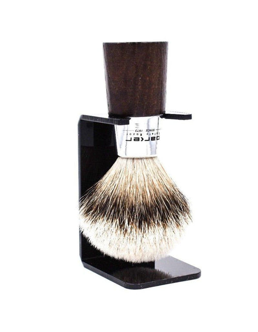 Parker WNST Shaving brush with wooden handle and black stand on a white background