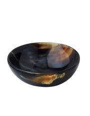 A handmade natural horn bowl with a unique pearl like shine and variation in color.