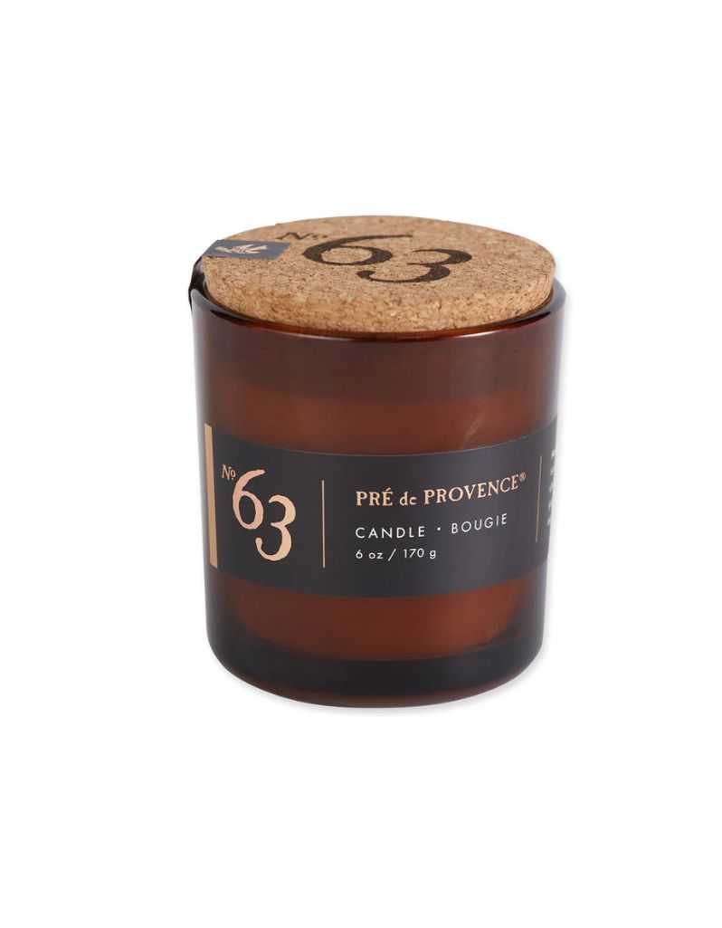 Candle with cork lid and 'Pre de Provence' label on a white background