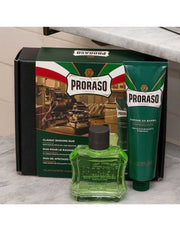Proraso shaving duo with green bottle and tube on a marble surface