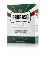 Box of Proraso After Shave Balm with packaging featuring green and white colors, brand name, and product details.