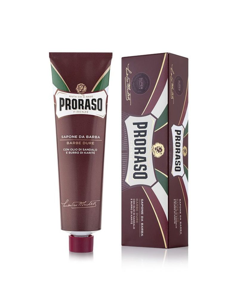 Proraso shaving cream tube and packaging, predominantly red and white with green accents, labeled for nourishing coarse beards.