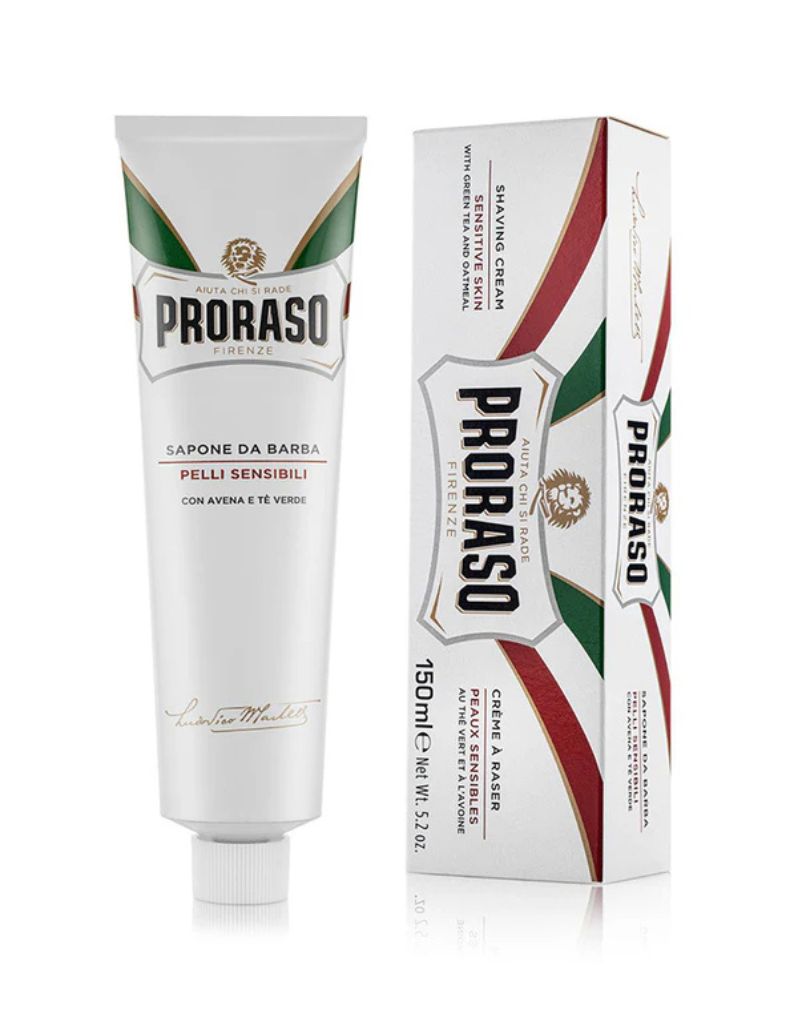 Proraso shaving cream tube and packaging for sensitive skin. The tube is white with green and red accents, and the packaging has the Proraso logo and the text 'Saponi da Barba'.