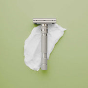 Rockwell T2 stainless steel razor with adjustable dial and twist-to-open blade loading for smooth custom shaving