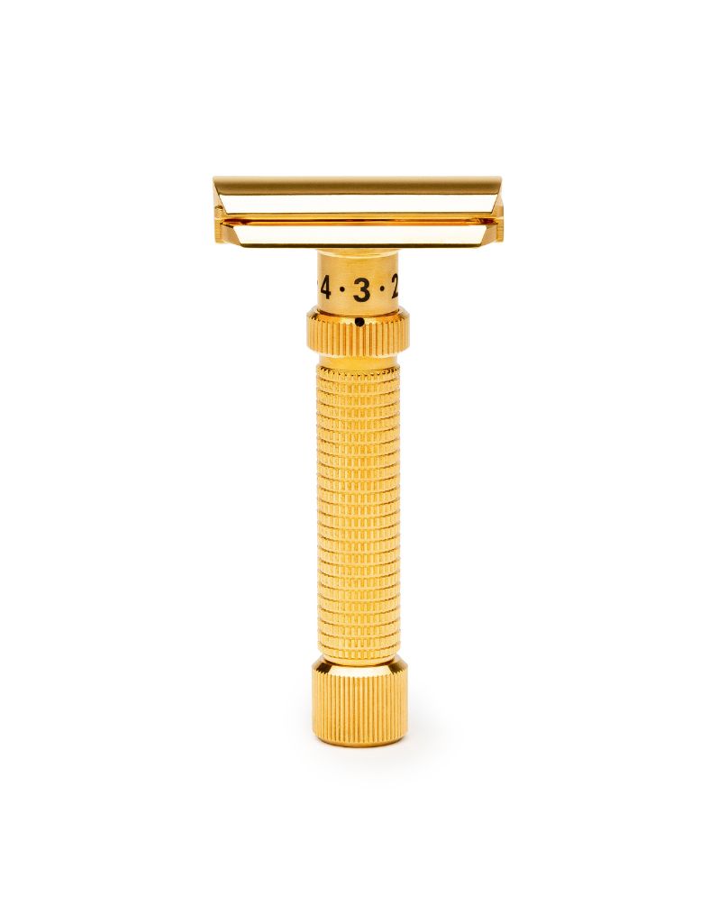 Gold-colored Rex Ambassador safety razor on a white background