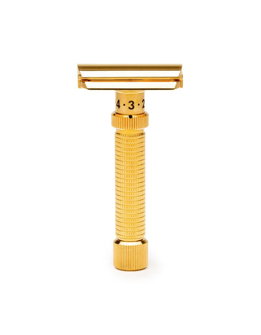 Gold-colored Rex Ambassador safety razor on a white background