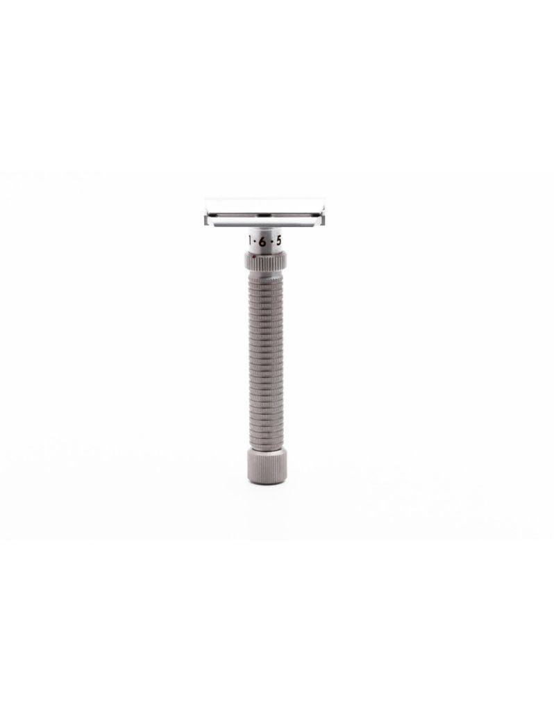 A silver double edge safety razor with an adjustable dial and textured handle, manufactured from marine-grade stainless steel.