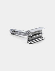 Rockwell R1 with butterfly head open, holding a Rockwell Swedish stainless steel blade