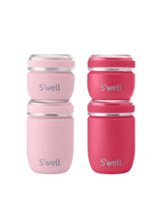 Two stacks of S’well travel containers in light pink and bright pink, each with a 50 ml jar on a 100 ml jar