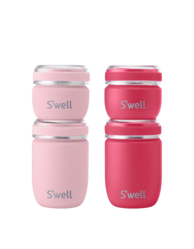 Two stacks of S’well travel containers in light pink and bright pink, each with a 50 ml jar on a 100 ml jar