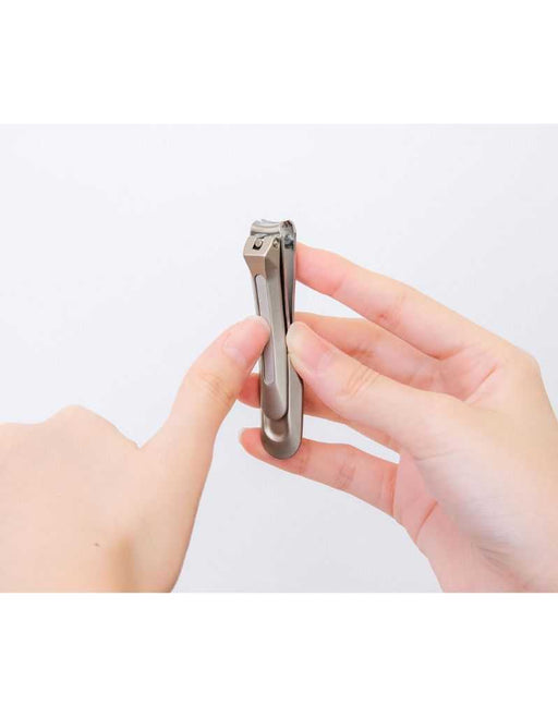Seki Nail clipper being used on a finger with a plain background