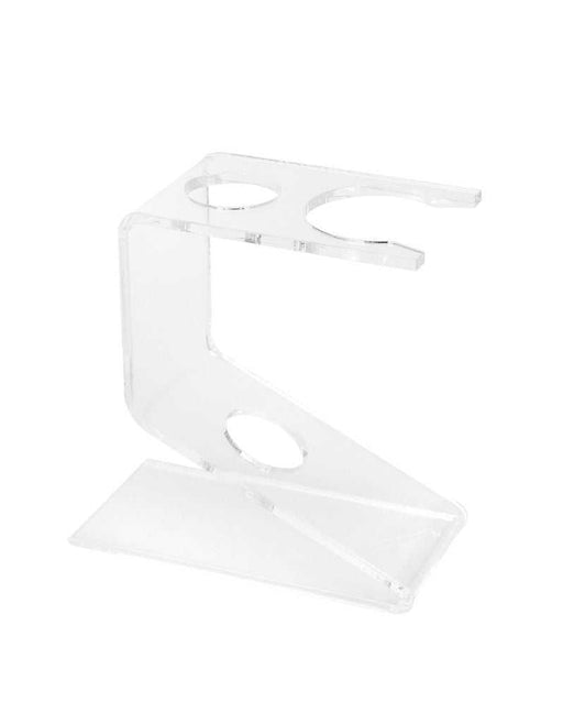 A clear acrylic shaving brush and safety razor stand on a white background.