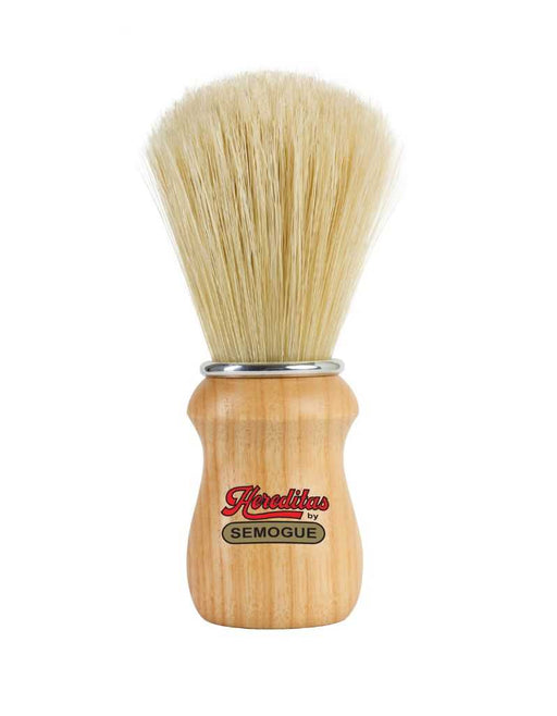 A Semogue 2000 Hereditas boar bristle shaving brush with an ash wood handle and a fan-shaped knot of bristles, featuring an aluminum ring at the base.