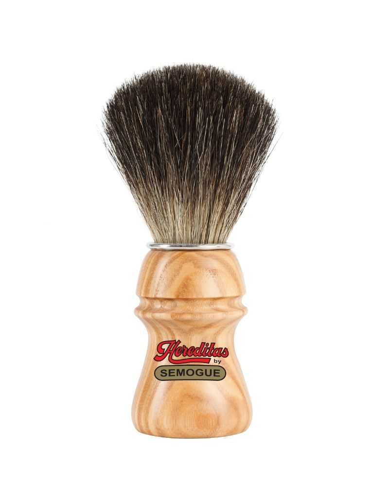 A Semogue shaving brush with black badger bristles and an ash wood handle with a matte finish. The handle features a chrome plated ring.