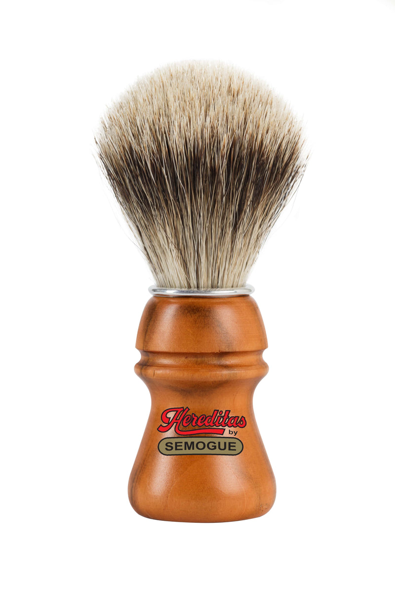 A Semogue shaving brush with a cherry wood handle and high density finest badger bristles, displayed with a focus on the handle and the knot of the brush.