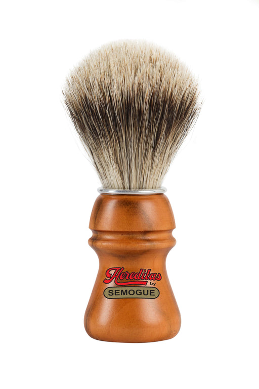 A Semogue shaving brush with a cherry wood handle and high density finest badger bristles, displayed with a focus on the handle and the knot of the brush.