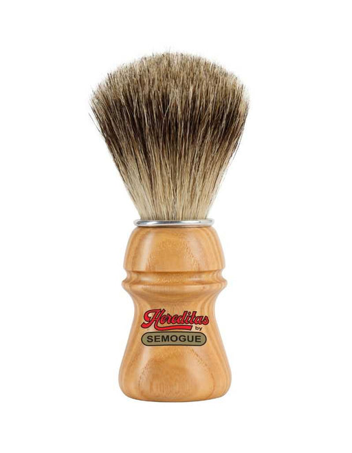 A badger shaving brush with a fan-shaped knot, featuring a chrome plated ring and an ash wood handle with the brand name 'Semogue' displayed.