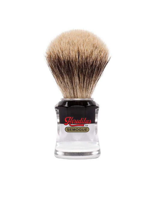 A Semogue 730 HD Hereditas badger shaving brush with a black and clear striped handle and a fan-shaped knot of bristles.
