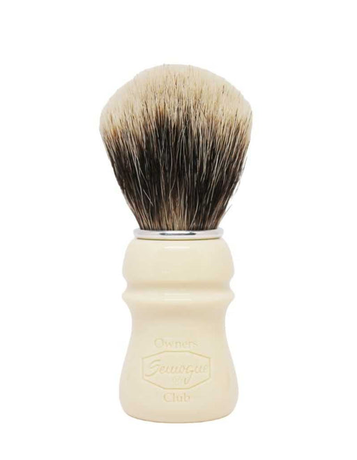 A Semogue shaving brush with a beige handle and finest badger bristles, showing the brush head, handle, and aluminum ring.
