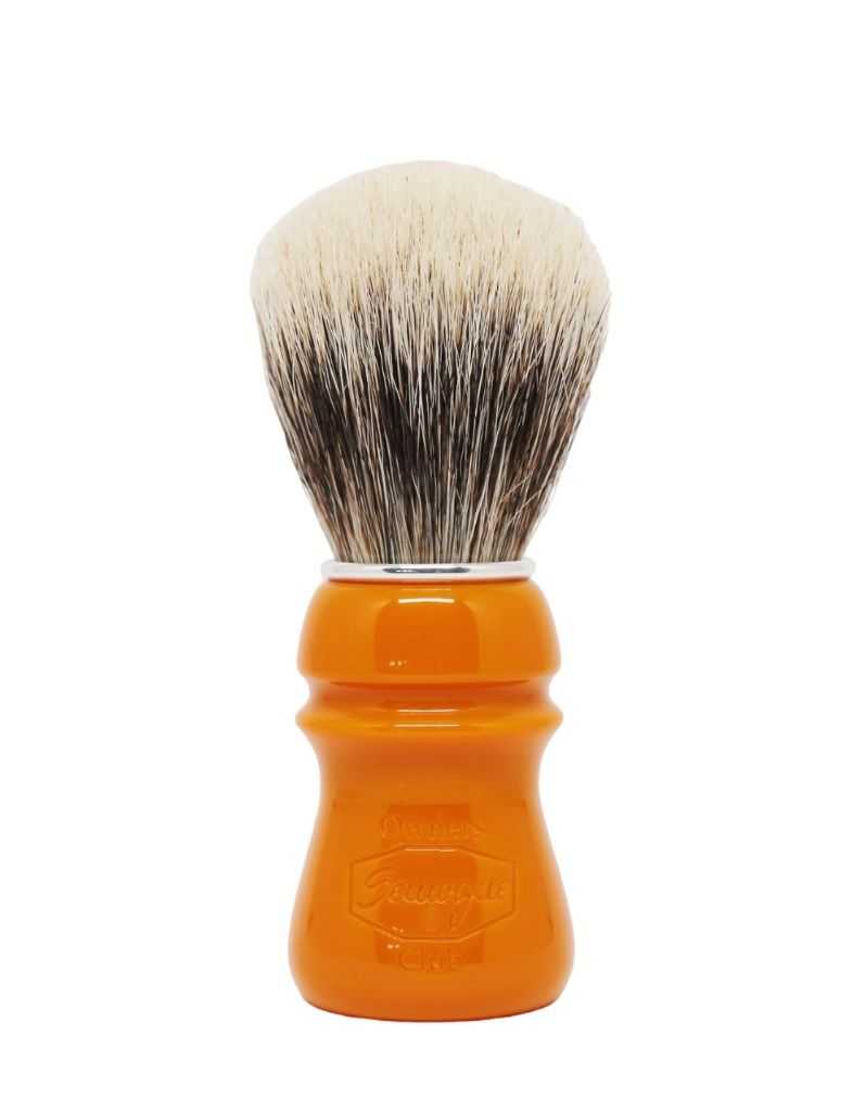 A Semogue shaving brush with a butterscotch colored handle and a fan-shaped knot of boar and badger bristles.