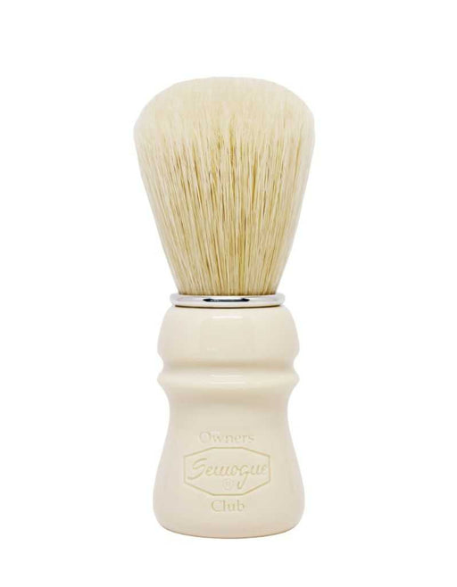A Semogue shaving brush with a Taj handle and boar bristles, displayed against a white background.
