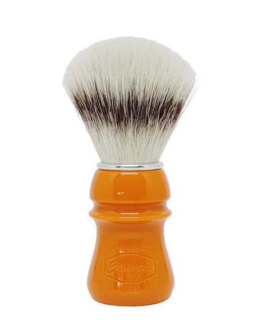 A Semogue Owner's Club C5 synthetic shaving brush with a butterscotch-colored handle and a fan-shaped knot of bristles.