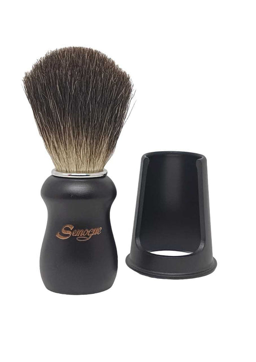 A Semogue Pharos C3 pure black badger shaving brush with a black wood handle and a chrome plated ring, displayed alongside its brush holder.