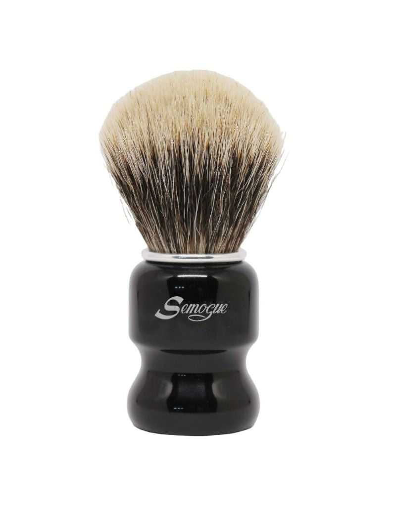A Semogue brand shaving brush with a jet black handle and finest badger bristles, featuring a fan shaped knot.