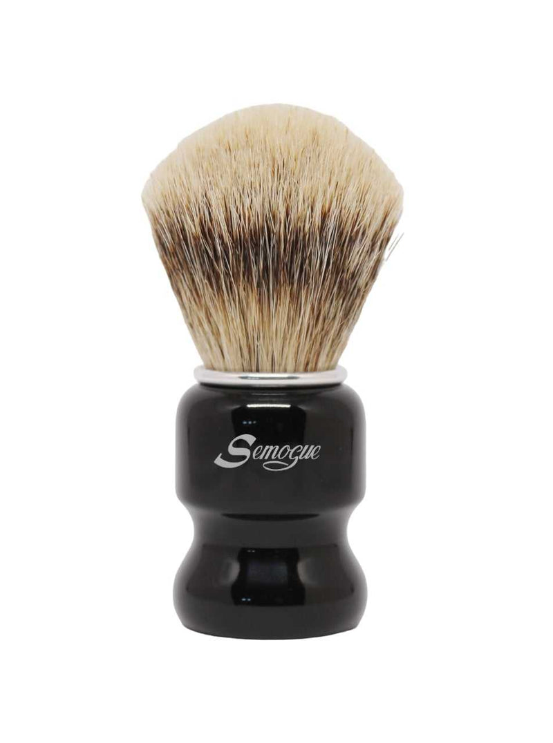 A Semogue Torga C5 silvertip badger shaving brush with a jet black handle and a fan shaped knot of bristles.