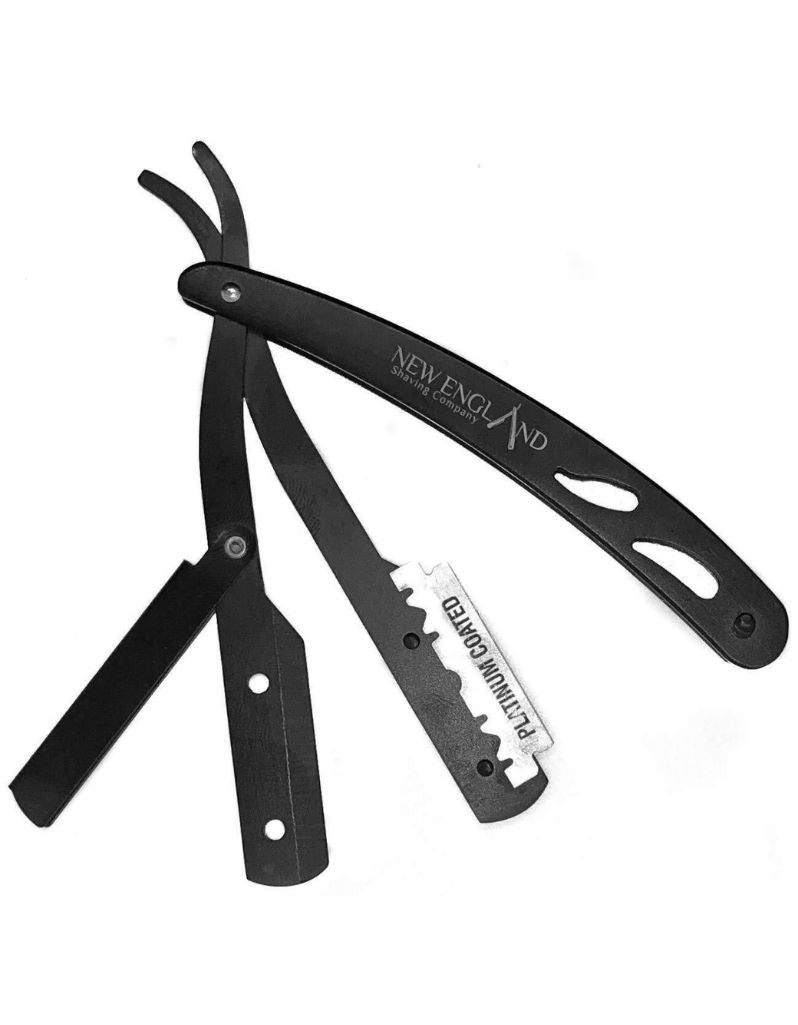 Black folding razor with 'New England' branding on a white background