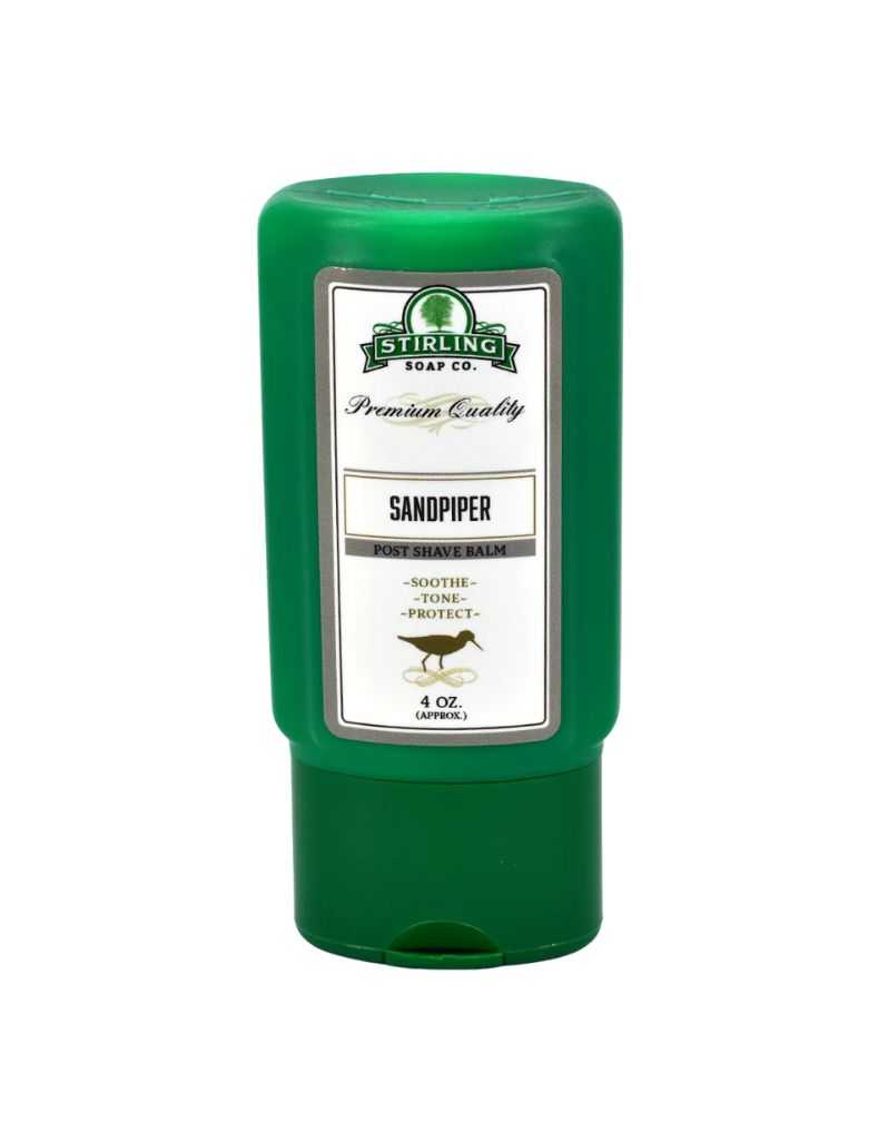 Green bottle of Stirling Soap Co. Sandpiper after shave balm on a white background