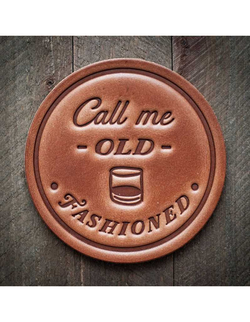 Round leather coaster with 'Call me OLD Fashioned' text on it 