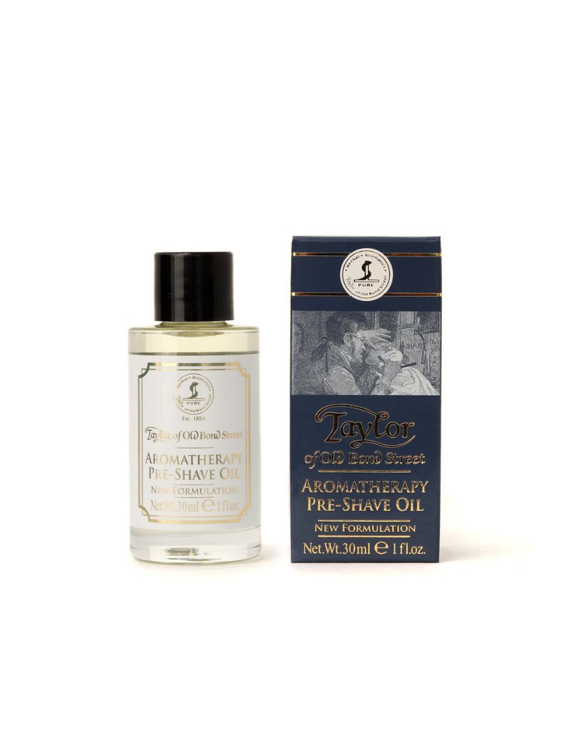 A product image showing a 30ml bottle of Taylor of Old Bond Street Aromatherapy Pre-Shave Oil next to its packaging box.