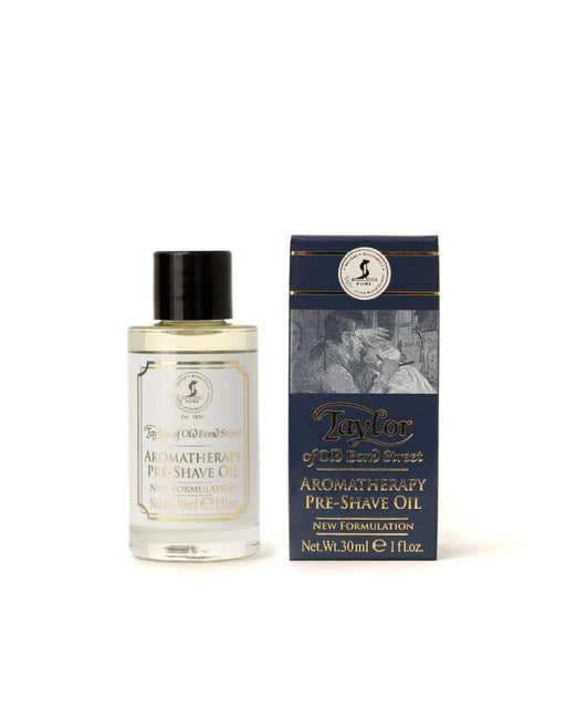 A product image showing a 30ml bottle of Taylor of Old Bond Street Aromatherapy Pre-Shave Oil next to its packaging box.