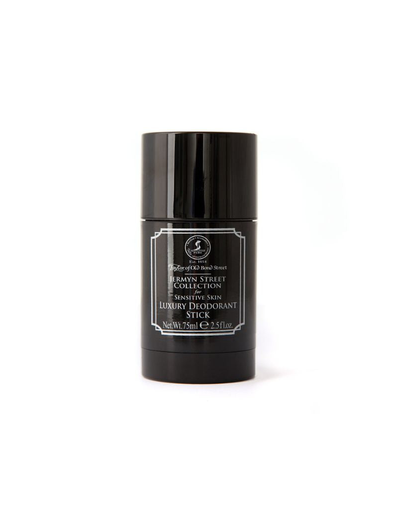 Black deodorant stick with a label on a white background
