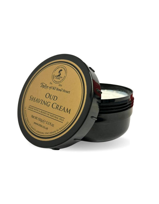 A container of Taylor of Old Bond Street Oud Shaving Cream with the lid open, showing the shaving cream inside.