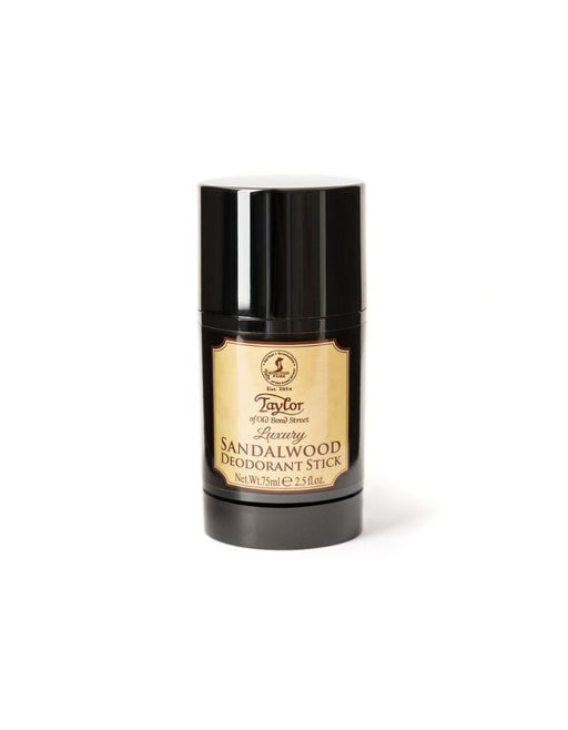 A black deodorant stick with a gold label that reads 'Taylor of Old Bond Street Sandalwood Deodorant Stick'.