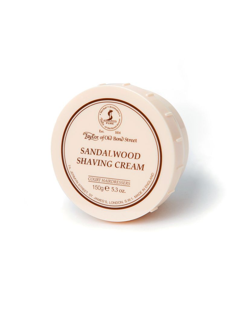 Round container of sandalwood shaving cream with branding on a white background